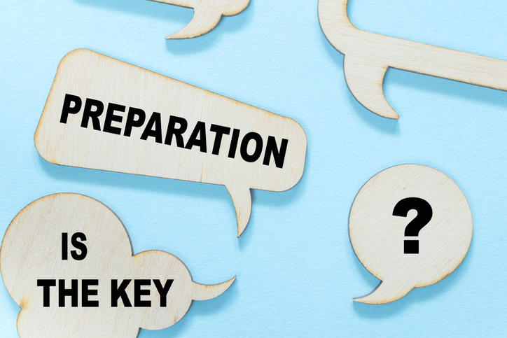 Preparation Is The Key. Concept meaning it reduces errors and shortens the activities Empty copy space red note wooden bubble light blue background.