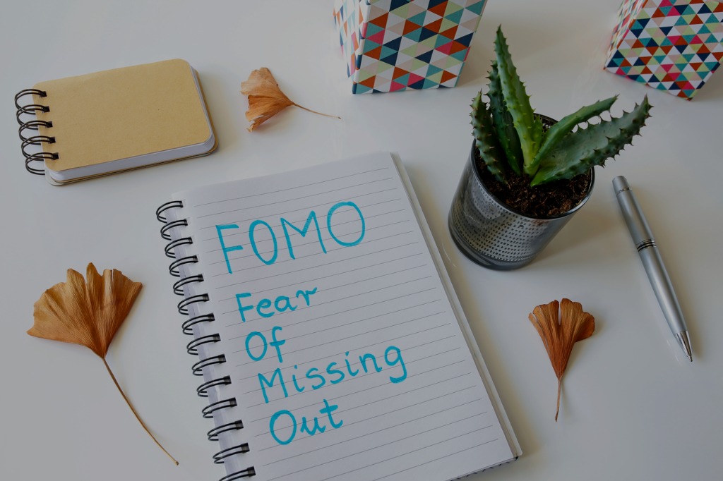 FOMO fear-of-missing-out written on notebook