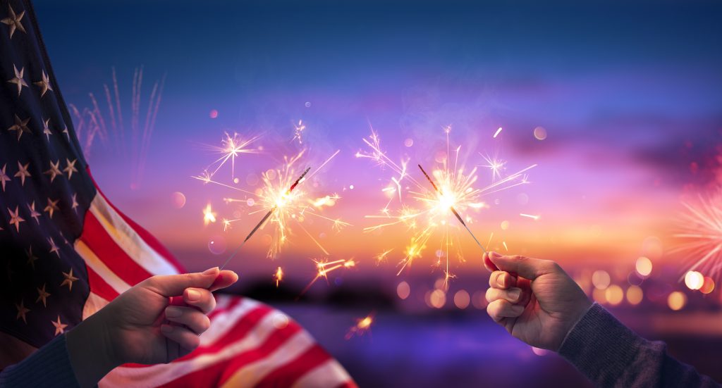 US Flag with hands holding Sparklers