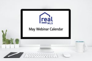 Computer Monitor in Modern Office with May Webinar Calendar text
