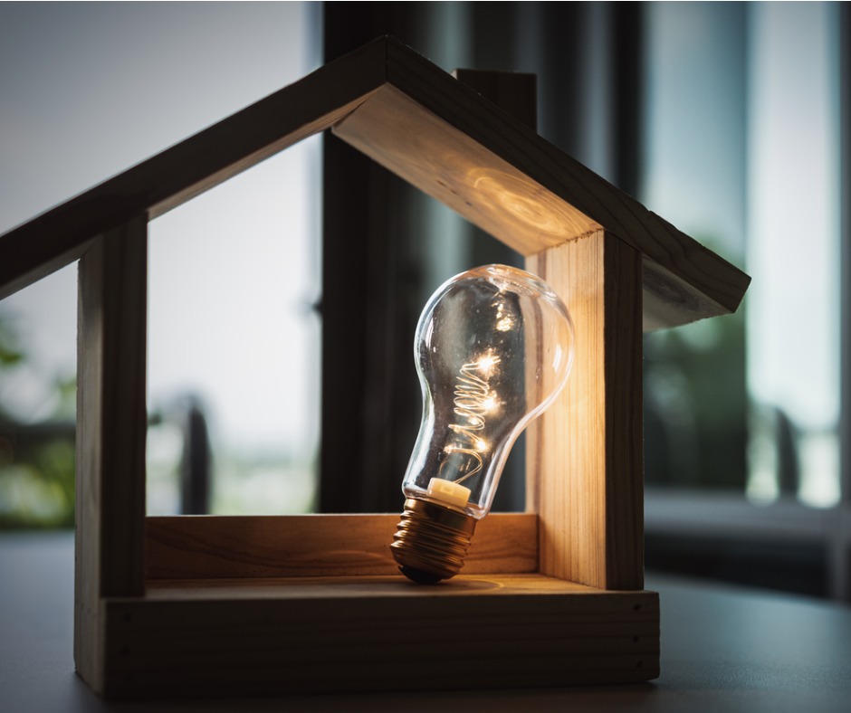 light-bulb-with-wood-house-on-the-table-a-symbol-for-construction